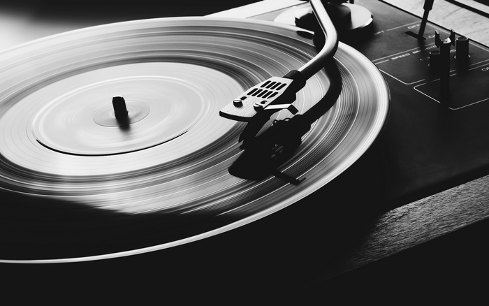 Monochrome vinyl record on a turntable