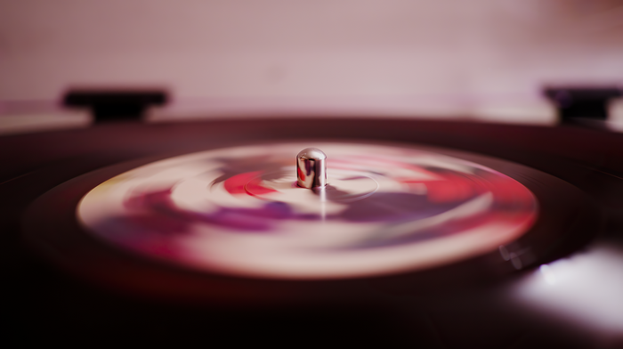 4K vinyl record spinning on a turntable