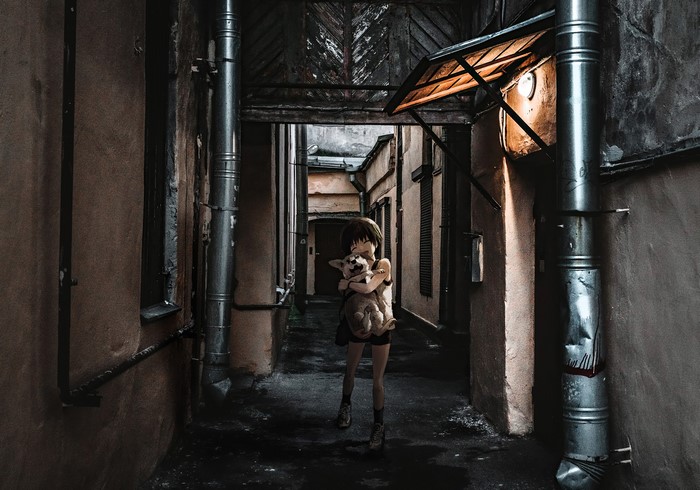 Anime girl holding a dog in St. Petersburg alley