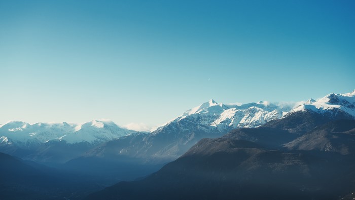 Snowy mountain peaks under a clear blue sky