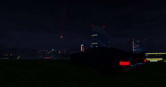 Black car in a city at night