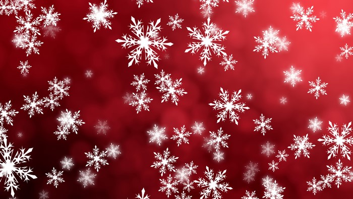 White snowflakes on a red background