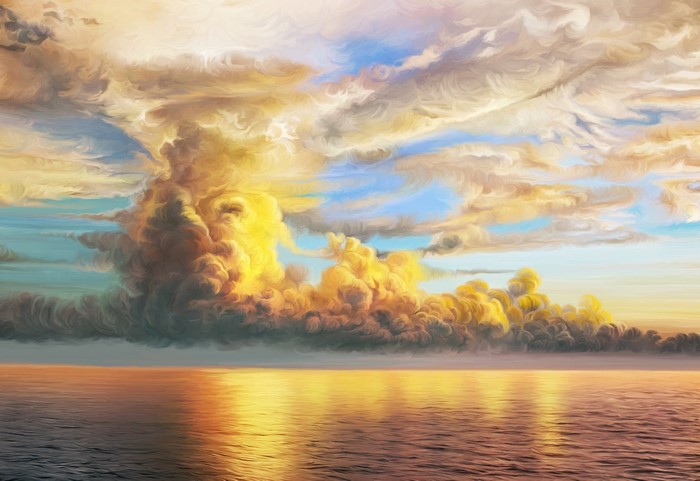Golden clouds over the ocean at sunset