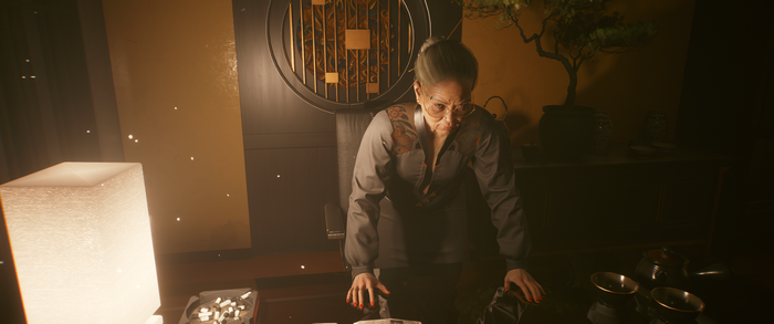 Woman in office with bonsai tree