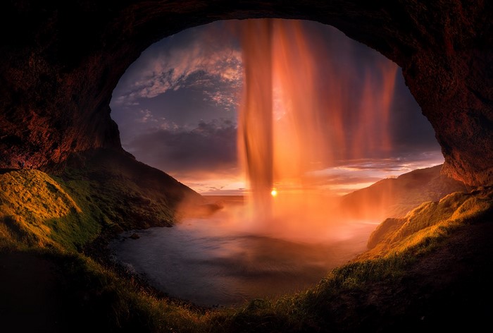 Seljalandsfoss Waterfall cave view at sunset, Iceland