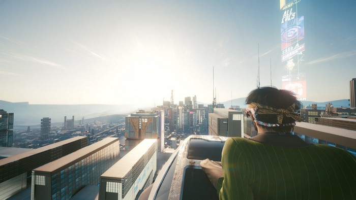 Cyberpunk 2077 cityscape with person overlooking