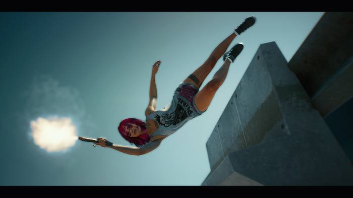 Woman with pink hair firing a gun while falling