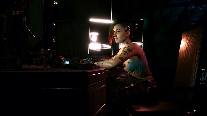 Judy Alvarez from Cyberpunk 2077 at a computer