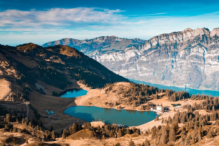 Aerial view of lakes and mountains with forest