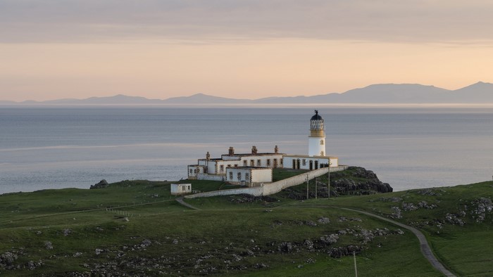 Lighthouse on a rocky coast overlooking the sea