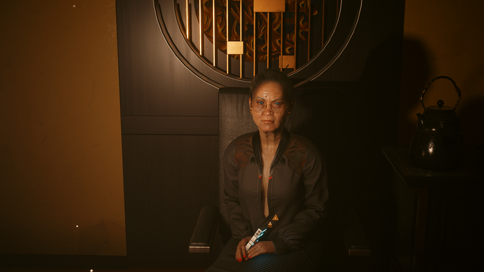 Woman in chair with futuristic glasses in Cyberpunk 2077