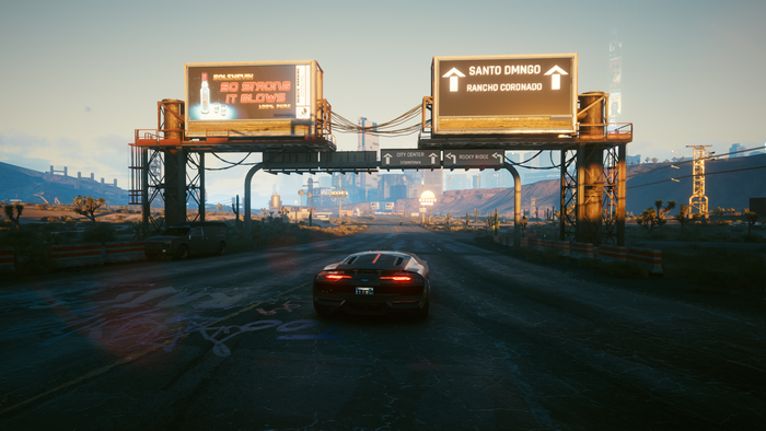 Cyberpunk 2077 car driving on a highway with billboards