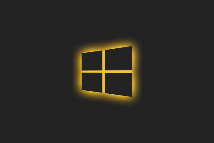 Windows 10 logo glowing yellow on dark background