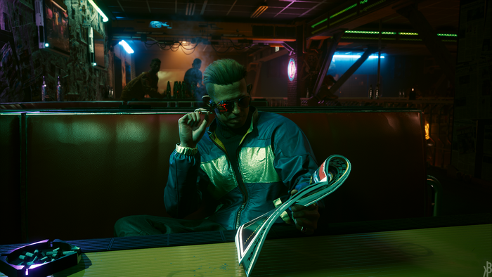 Man in Cyberpunk 2077 reading a magazine