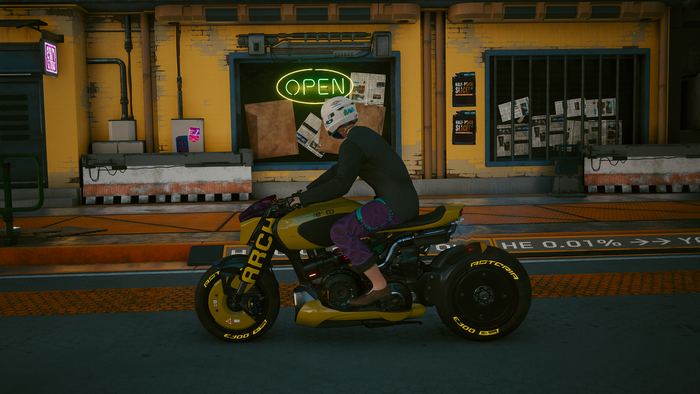 Person riding a yellow ARCH motorcycle in Cyberpunk 2077