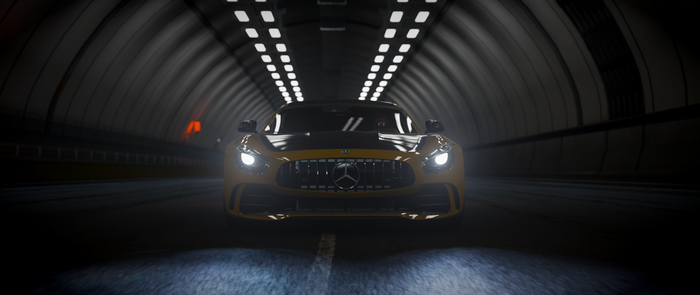 Yellow Mercedes AMG driving through a tunnel