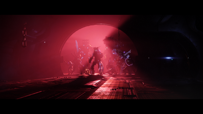 Destiny 2: Guardians and enemies in a red-lit chamber