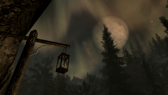 The Elder Scrolls V: Skyrim night landscape with moon and aurorae
