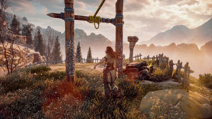 Aloy from Horizon Zero Dawn in a mountainous landscape