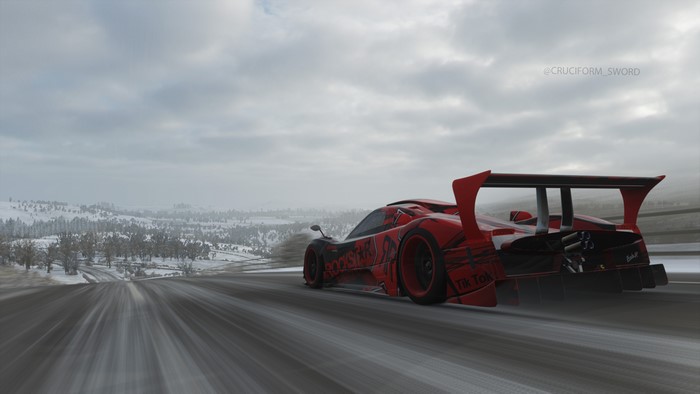 Red supercar with TikTok livery on a snowy road in Forza Horizon 4
