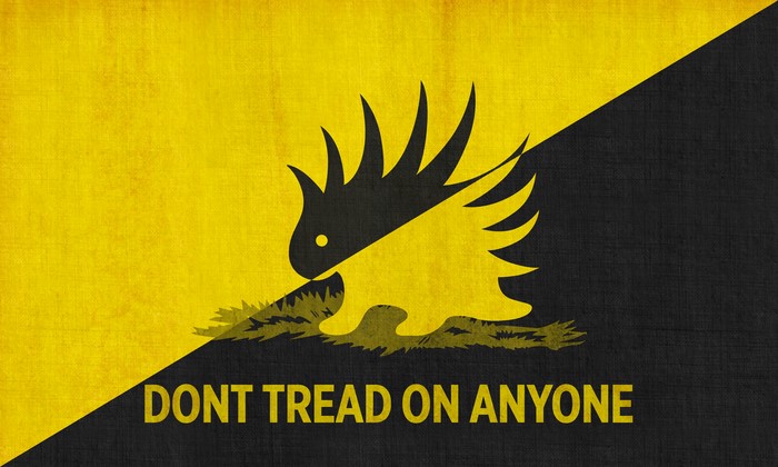Anarcho-capitalist flag with porcupine and text