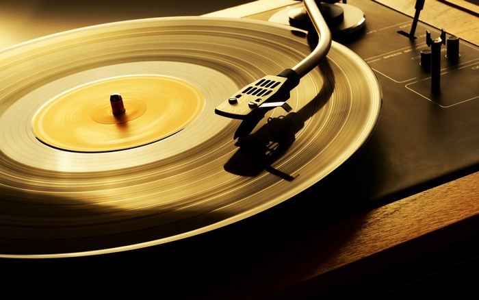 Vinyl record on a turntable with a tonearm