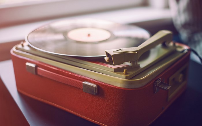 Vintage red record player with vinyl record