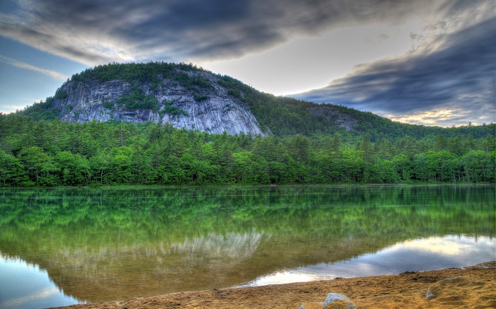 Lake reflection of a mountain and forest