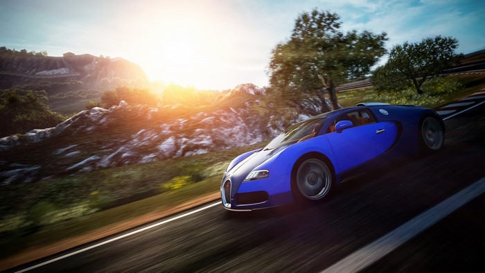 Blue Bugatti Veyron driving on a scenic road