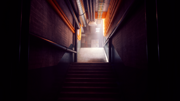 Stairs in a dark industrial hallway