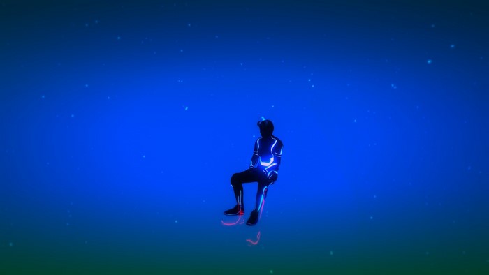 Man in glowing suit sitting in blue space