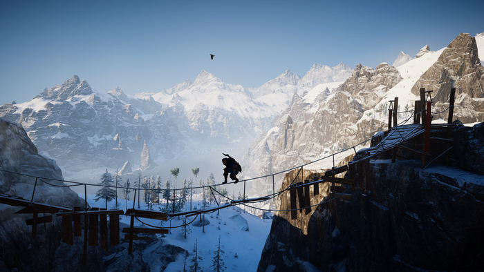 Eivor on a rope bridge in snowy mountains