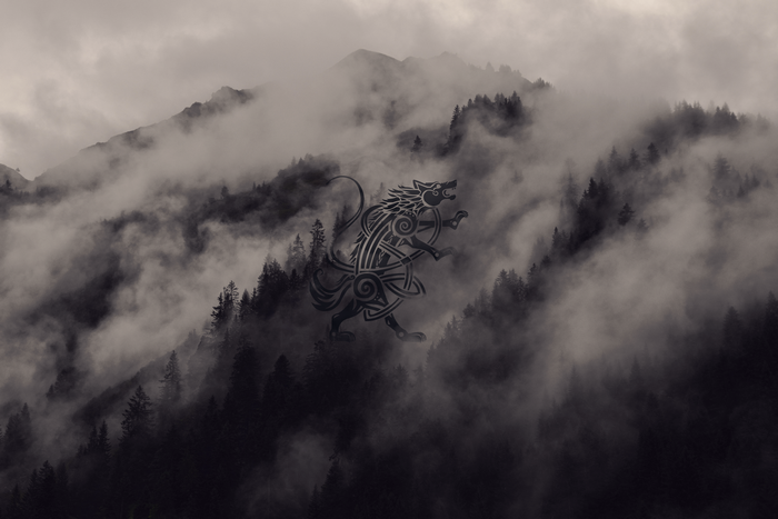 Viking wolf symbol in misty mountains