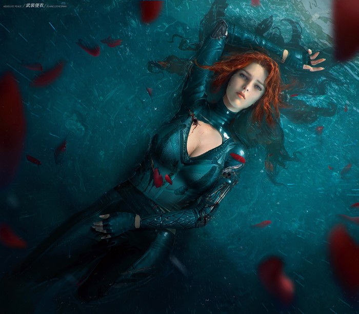 Fantasy girl with red hair in water