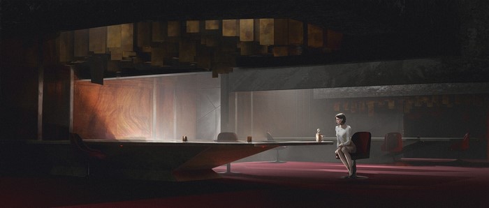 Woman sitting alone at a long table