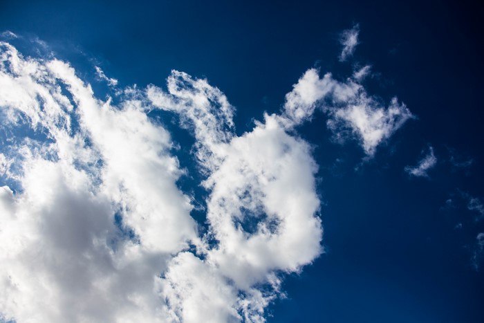 White clouds against a deep blue sky