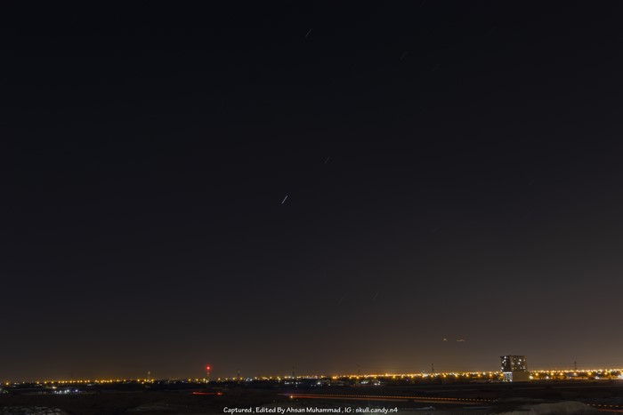Night sky over Ajman with city lights