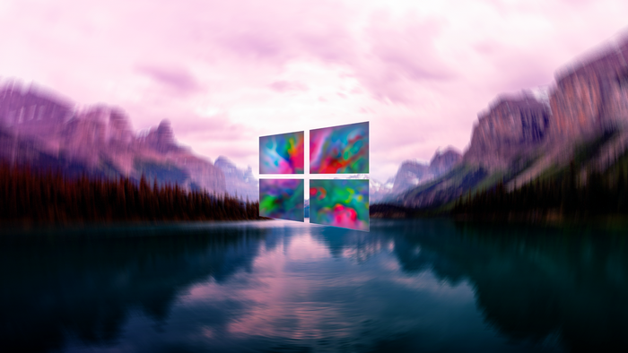 Windows 10 logo over a lake and mountains