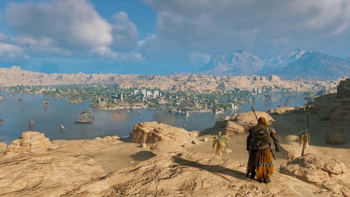 Bayek from Assassin's Creed Origins overlooking a city