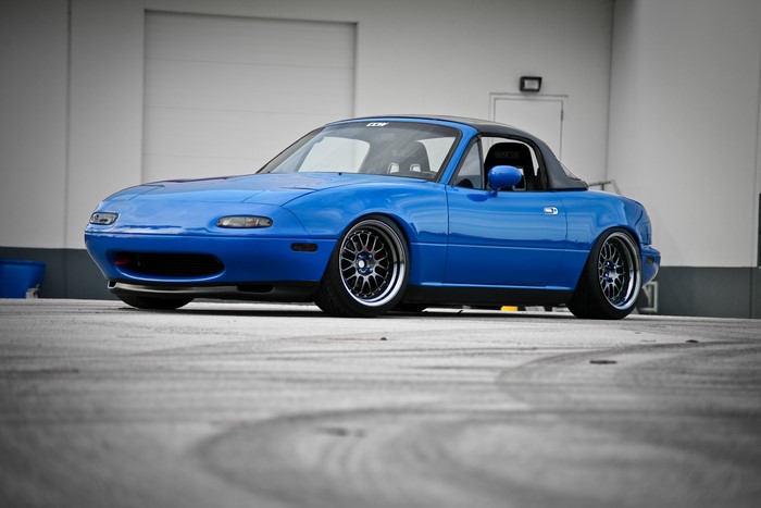 Blue Mazda MX-5 with custom wheels