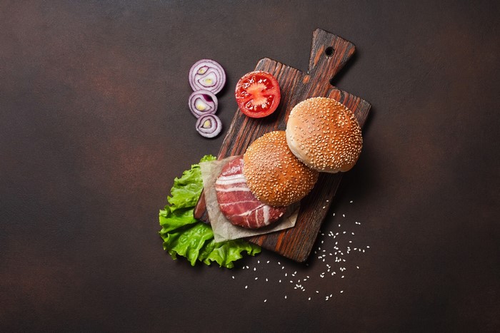 Burger ingredients on a cutting board