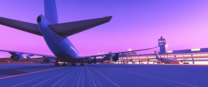 Digital art of an airport at sunset with airplanes