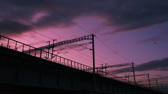 Electric train overhead lines at sunset