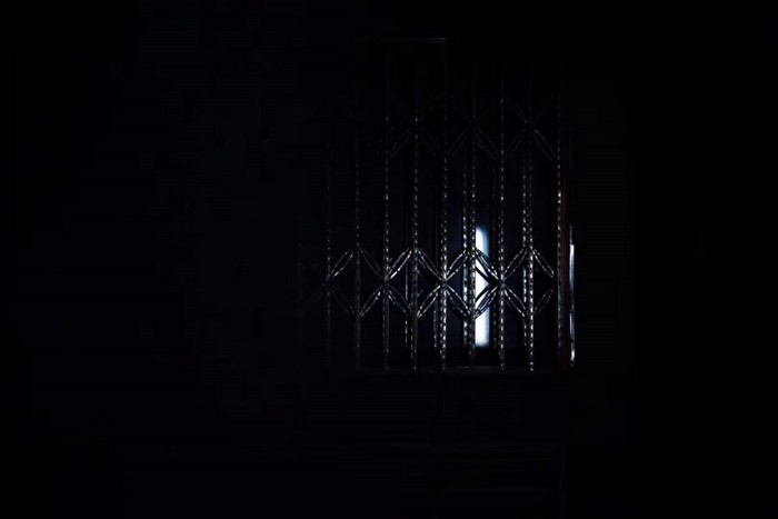 Darkness with a metal gate and light