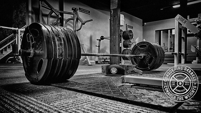 Barbell with heavy weights in a gym