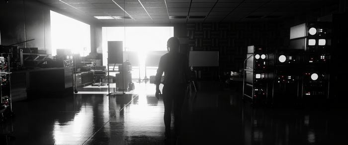 Woman in a dimly lit laboratory with retro equipment