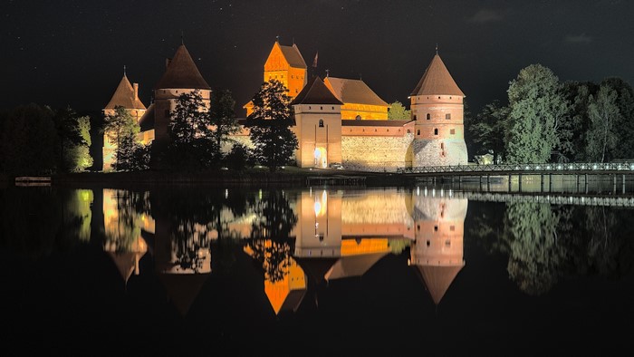 Trakai Island Castle at night with reflection
