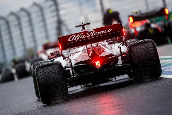 Alfa Romeo Formula 1 car on a wet race track