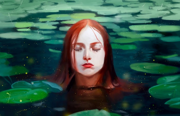 Redhead woman with closed eyes in a lake with lily pads