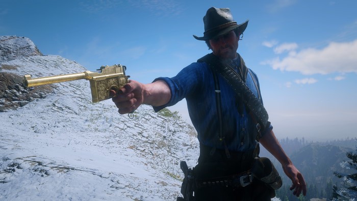 Arthur Morgan from Red Dead Redemption 2 holding a golden gun